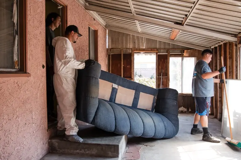 Crew removing furniture during an estate cleanout